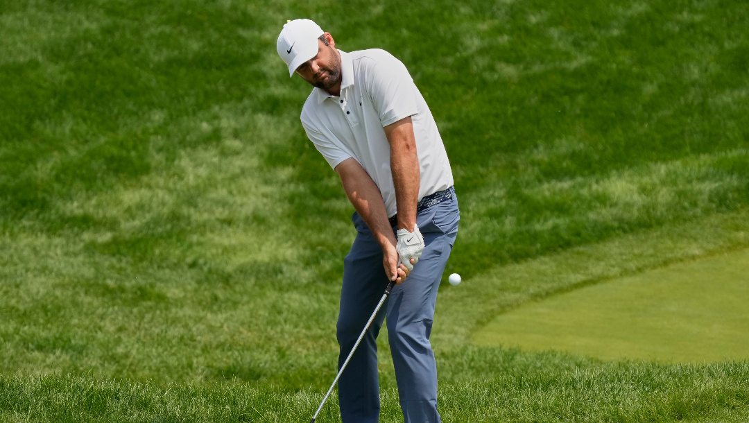 Scottie Scheffler chips onto the fourth green during the final round of the Memorial golf tournament Sunday, June 1, 2025, in Dublin, Ohio.