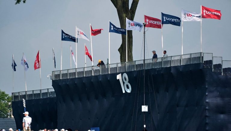 Fans walk up the ninth fairway toward the clubhouse during a practice round for the 2025 US Open golf championship at Oakmont Country Club in Oakmont, Pa., Monday, June 9, 2025.