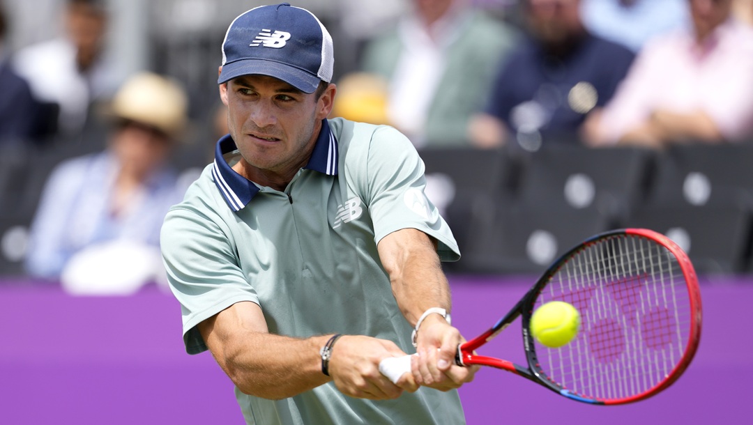 Tommy Paul of the US plays a return to Alejandro Tabilo of Chile during their men's singles match on day six of The Queen's Club tennis tournament, in London, Thursday, June 20, 2024.