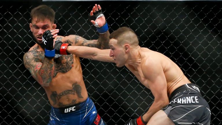 Kai Kara-France, right, lands a punch against Cody Garbrandt during a flyweight mixed martial arts bout at UFC 269, Saturday.