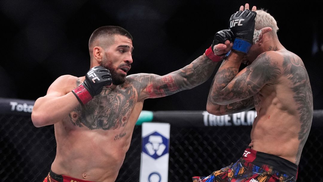 Ilia Topuria, left, fights Charles Oliveira in a lightweight title fight at UFC 317, Saturday, June 28, 2025, in Las Vegas.