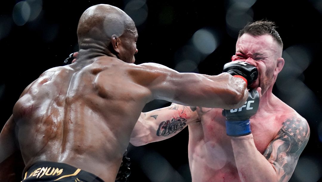 Kamaru Usman lands a punch against Colby Covington during a welterweight mixed martial arts championship bout at UFC 268.