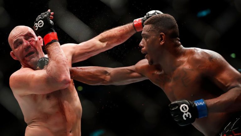 United States' Jamahal Hill, right, competes with Brazil's Glover Teixeira in a light heavyweight title bout at the UFC 283.