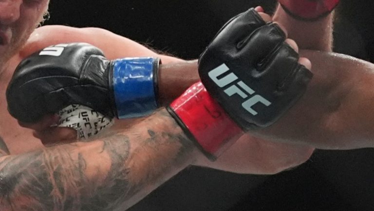 Dominican Republic's Waldo Cortes Acosta, right, punches Moldova's Serghei Spivac during the third round of a heavyweight bout.