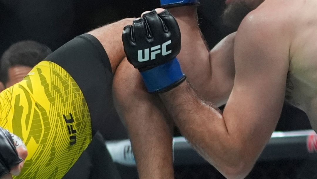 Marquel Mederos, left, kicks Mark Choinski during the second round of a lightweight bout at the UFC 316 mixed martial arts event.
