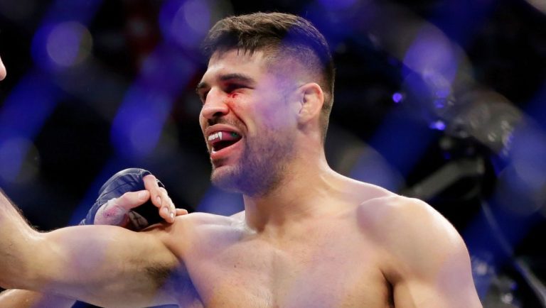 Michael Chiesa, left, Vicente Luque, right, react after Luque's win by submission in the first round during their welterweight.