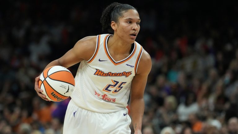 Phoenix Mercury forward Alyssa Thomas dribbles the ball against the Dallas Wings during the first half of a WNBA basketball game Monday, July 7, 2025, in Phoenix.