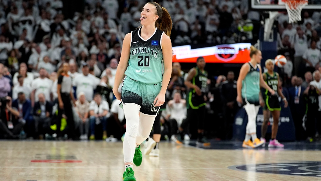 New York Liberty guard Sabrina Ionescu celebrates after making a 3-point basket during the second half against the Minnesota Lynx in Game 3 of a WNBA basketball final playoff series, Wednesday, Oct. 16, 2024, in Minneapolis. The Liberty won 80-77.