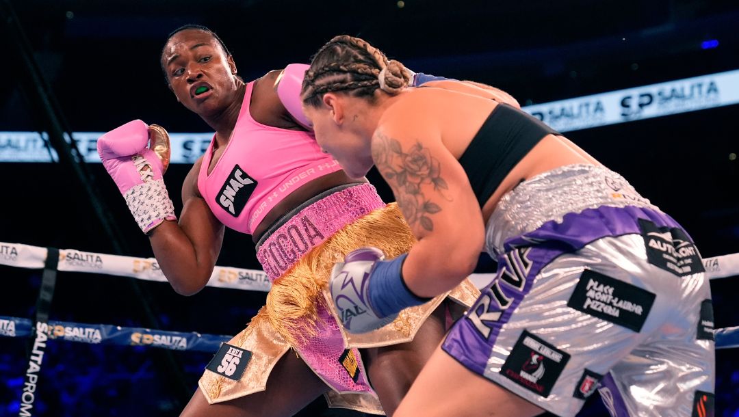 FILE - Middleweight champion Claressa Shields, left, fights reigning WBC women's heavyweight boxing champion Vanessa.