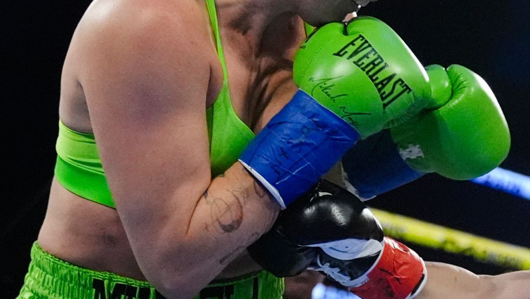 England's Sandy Ryan punches Mikaela Mayer of the U.S., during a women's WBO welterweight title boxing bout Saturday.