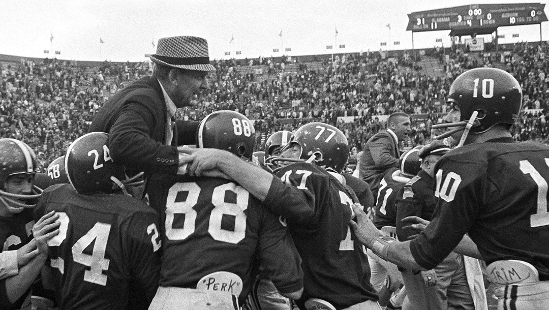 FILE - In this Dec. 5, 1966, file photo, Alabama football players hoist coach Paul "Bear" Bryant to their shoulders after the Crimson Tide finished an unbeaten, untied season with a 31-0 triumph over Auburn in Birmingham, Ala. Identifiable players are, from left, John Mosley, Ray Perkins, Jerry Duncan and Wayne Trimble. Despite Alabama's success in the 1960s, the Tide was only voted No. 1 nine times.