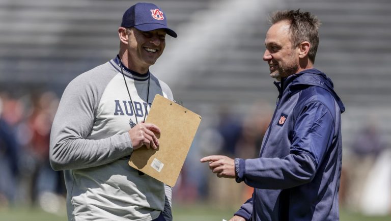 Auburn head coach Bryan Harsin, left, talks with offensive coordinator Eric Kiesau during the A-Day NCAA college spring football game at Jordan-Hare Stadium, Saturday, April 9, 2022, in Auburn, Ala.
