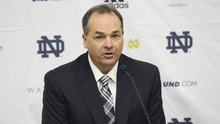 Notre Dame offensive coordinator Mike Denbrock answers questions during a news conference, Jan. 31, 2013, in South Bend, Ind. Denbrock is back for a third coaching stint at Notre Dame, this time as offensive coordinator. The school announced Denbrock's hiring on Wednesday, Dec. 27, 2023.