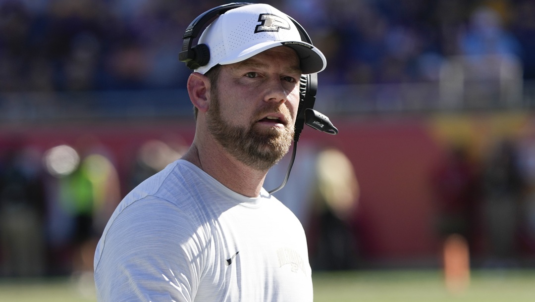 Purdue interim coach Brian Brohm walks to the sideline after a timeout during the first half of the team's Citrus Bowl NCAA college football game against LSU, Jan. 2, 2023, in Orlando, Fla. Brohm, now offensive coordinator at Louisville, will be reunited with former Purdue quarterback Jack Plummer.