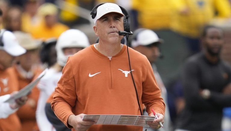 Texas offensive coordinator Kyle Flood watches against Michigan in the first half of an NCAA college football game in Ann Arbor, Mich., Saturday, Sept. 7, 2024.