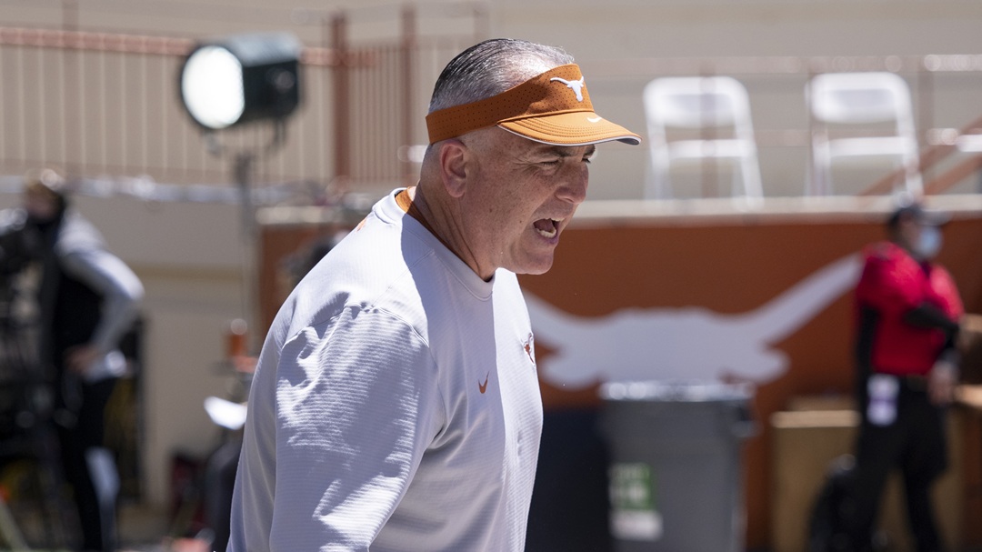 Texas offensive coordinator Kyle Flood works with the offensive line before the Texas Orange and White Spring Scrimmage in Austin, Texas, Saturday, April 24, 2021.