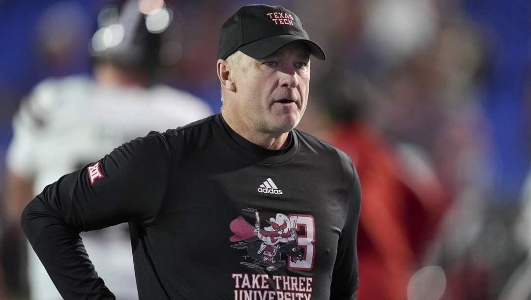 Texas Tech head coach Joey McGuire walks the field before the Liberty Bowl NCAA college football game against Arkansas, Friday, Dec. 27, 2024, in Memphis, Tenn.