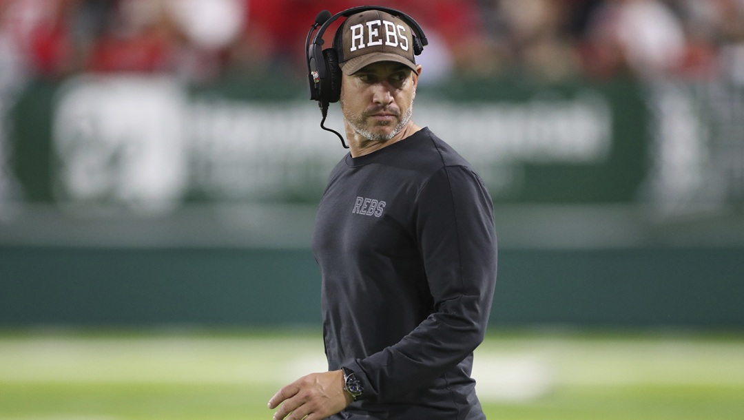 UNLV coach Marcus Arroyo waits for the team's NCAA college football game against Hawaii, Saturday, Nov. 19, 2022, in Honolulu.