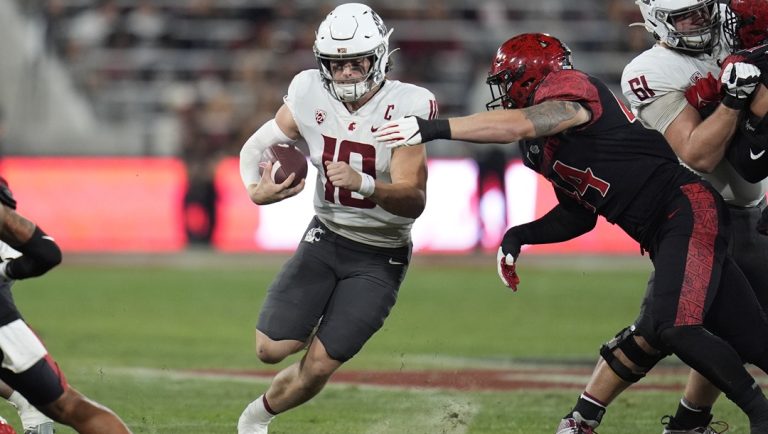 Washington State quarterback John Mateer runs with the ball during the first half of an NCAA college football game against San Diego State, Oct. 26, 2024, in San Diego.