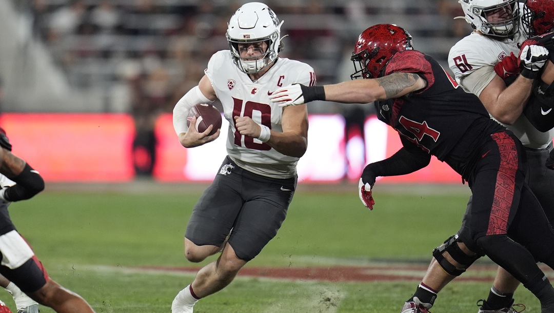 Washington State quarterback John Mateer runs with the ball during the first half of an NCAA college football game against San Diego State, Oct. 26, 2024, in San Diego.