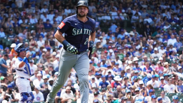 Seattle Mariners' Cal Raleigh walks to first base during the third inning of a baseball game against the Chicago Cubs in Chicago, Sunday, June 22, 2025.