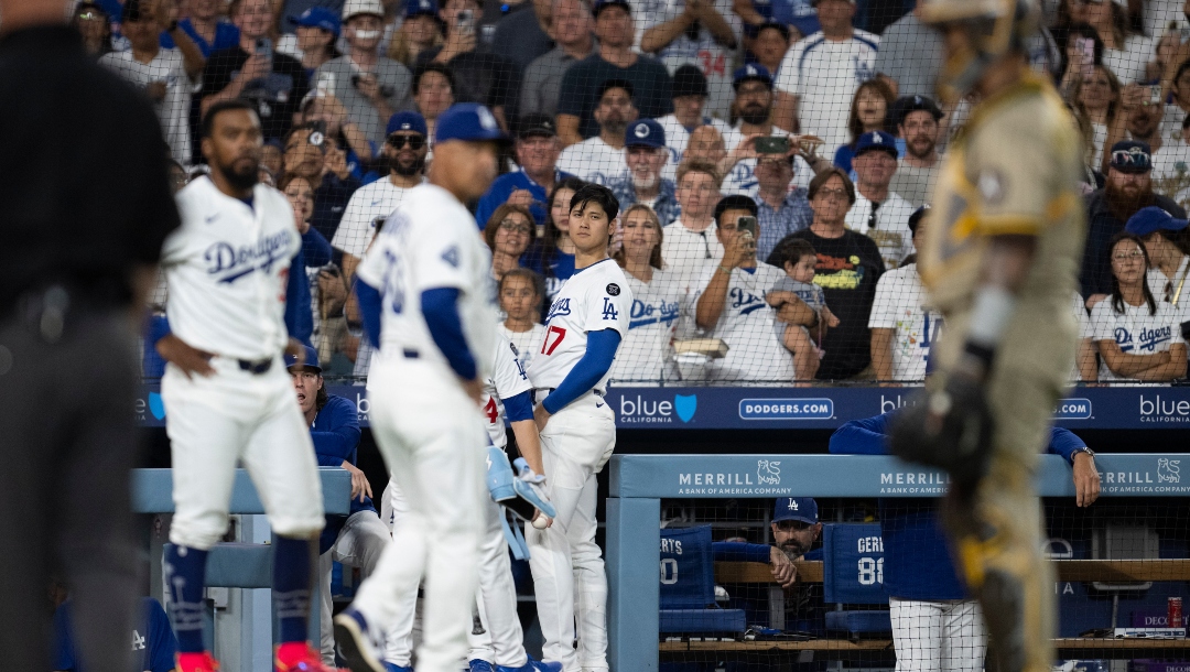 Los Angeles Dodgers' Shohei Ohtani looks towards the field as teams clear the benches on a hit by pitch during a baseball game between the Los Angeles Dodgers and the San Diego Padres, in Los Angeles, Monday, June 16, 2025.