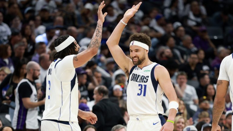 Klay Thompson #31 high fives Anthony Davis #3 of the Dallas Mavericks after Davis made a basket against the Sacramento Kings during the first half of the NBA play-in tournament game at Golden 1 Center on April 16, 2025 in Sacramento, California.