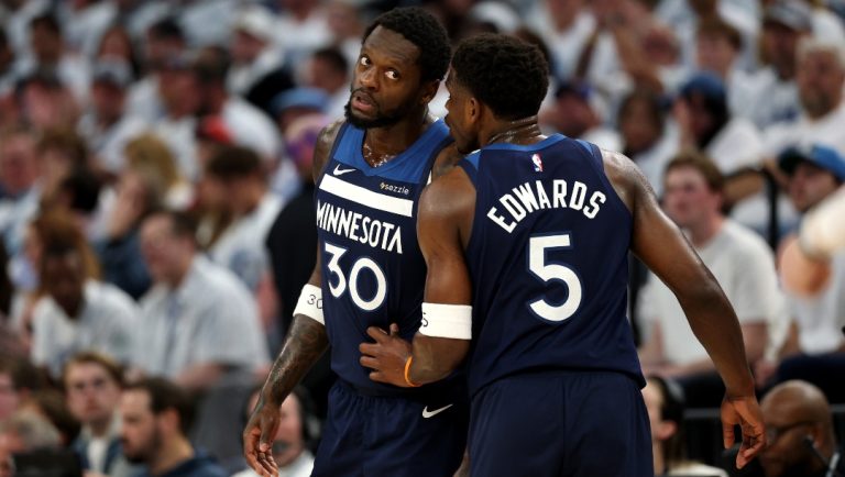 Anthony Edwards #5 of the Minnesota Timberwolves talks with Julius Randle #30 against the Oklahoma City Thunder during the first quarter in Game Three of the Western Conference Finals of the 2025 NBA Playoffs at Target Center on May 24, 2025 in Minneapolis, Minnesota.
