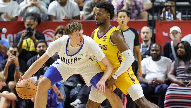 LAS VEGAS, NEVADA - JULY 10: Cooper Flagg #32 of the Dallas Mavericks is guarded by Bronny James #9 of the Los Angeles Lakers in the first half of a 2025 NBA Summer League game at the Thomas & Mack Center on July 10, 2025 in Las Vegas, Nevada.