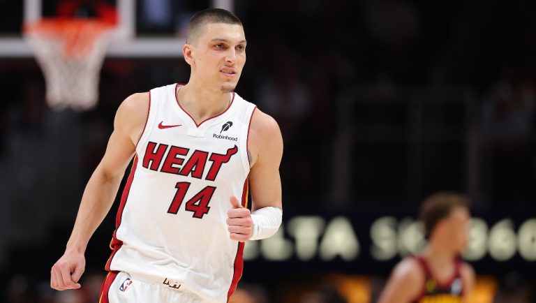 Tyler Herro #14 of the Miami Heat reacts after a basket against the Atlanta Hawks during the fourth quarter of an NBA play-in tournament game on April 18, 2025 in Atlanta, Georgia.