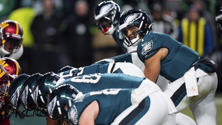 Philadelphia Eagles quarterback Jalen Hurts (1) lines up for the goal line Tush Push play during the NFL championship playoff football game against the Washington Commanders, Jan. 26, 2025, in Philadelphia.