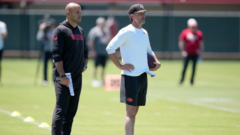 San Francisco 49ers defensive coordinator Robert Saleh left, and head coach Kyle Shanahan, right, watch players take part in drills during the NFL football team's rookie minicamp in Santa Clara, Calif., Friday, May 9, 2025.