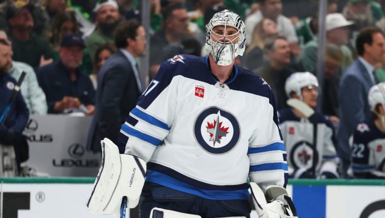 Winnipeg Jets goaltender Connor Hellebuyck skates on the ice during a media time out in the first period of Game 4 of a second-round NHL hockey playoff series aginast the Dallas Stars in Dallas, Tuesday, May 13, 2025.