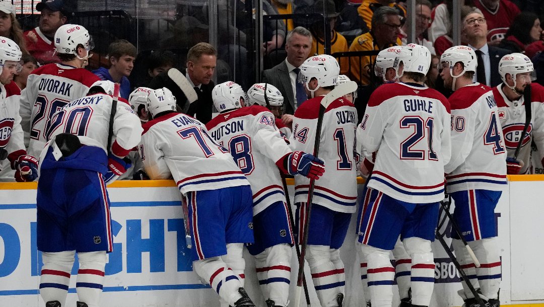 Montreal Canadiens players listen to coaches during the third period of an NHL hockey game against the Nashville Predators Sunday, April 6, 2025, in Nashville, Tenn.