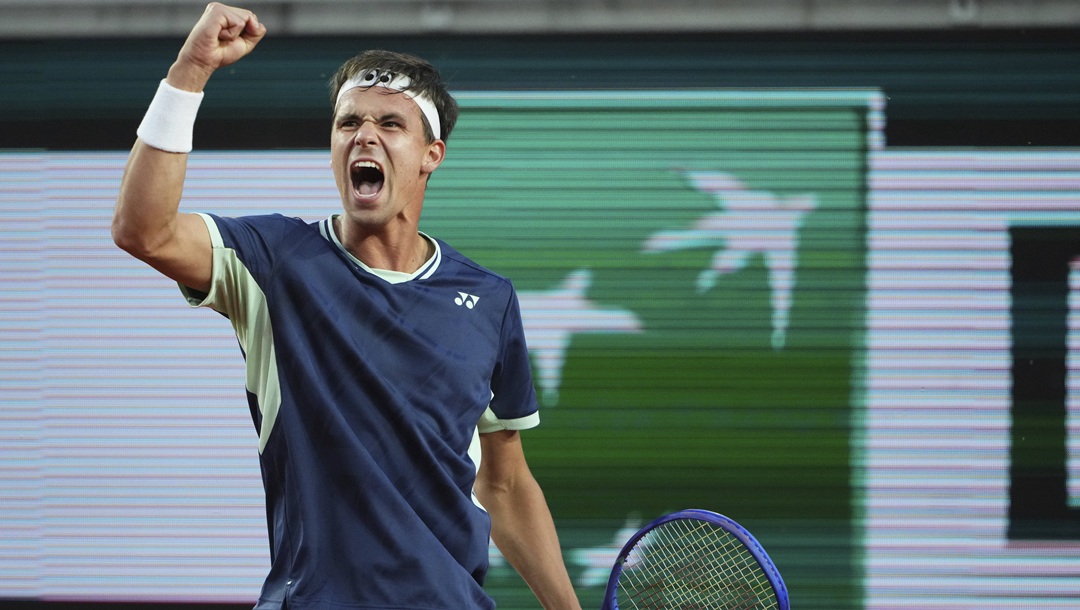 Germany's Daniel Altmaier reacts winning a point to Frances Tiafoe of the U.S. during their fourth round match of the French Tennis Open, at the Roland-Garros stadium, in Paris, Sunday, June 1 2025.