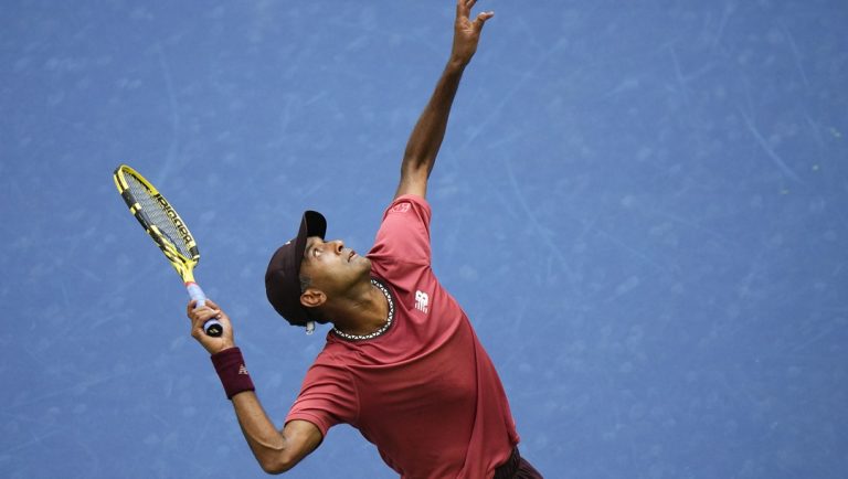 Rajeev Ram, of the United States, serves to Rohan Bopanna, of India, and Matthew Ebden, of Australia, during the men's doubles final of the U.S. Open tennis championships, Friday, Sept. 8, 2023, in New York.