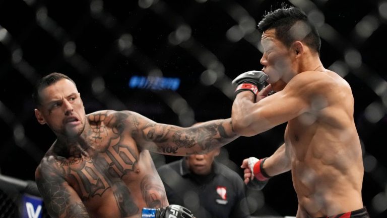 Daniel Rodriguez hits Li Jingliang in a 180-pound catchweight bout during the UFC 279 mixed martial arts event Saturday.
