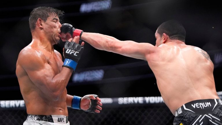 obert Whittaker, right, connects with Paulo Costa during their middleweight bout at the UFC 298 mixed martial arts event.