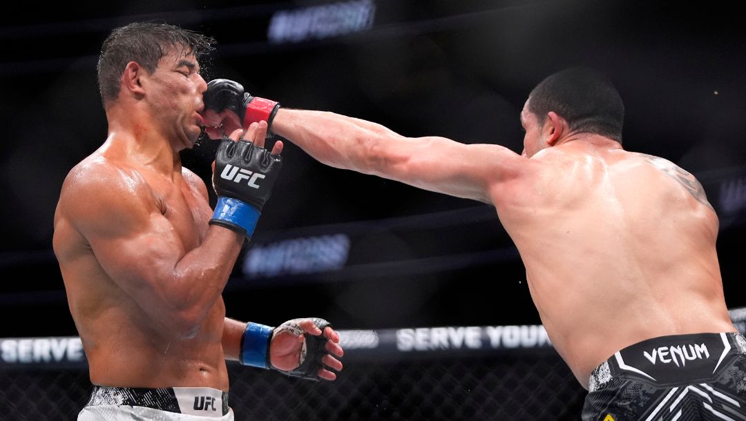 obert Whittaker, right, connects with Paulo Costa during their middleweight bout at the UFC 298 mixed martial arts event.