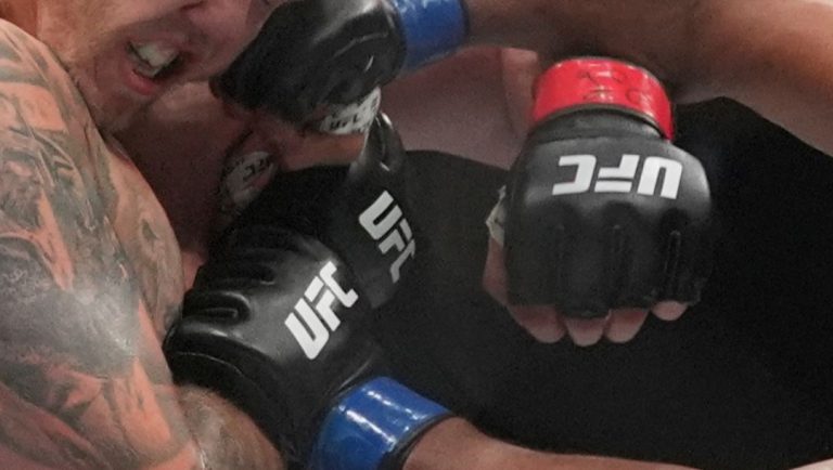 Dominican Republic's Waldo Cortes Acosta, right, punches Moldova's Serghei Spivac during the first round of a heavyweight bout.