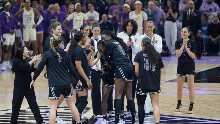 Golden State Valkyries head coach Natalie Nakase, left, and players gather before a WNBA basketball game against the Los Angeles Sparks in San Francisco, Friday, May 16, 2025.