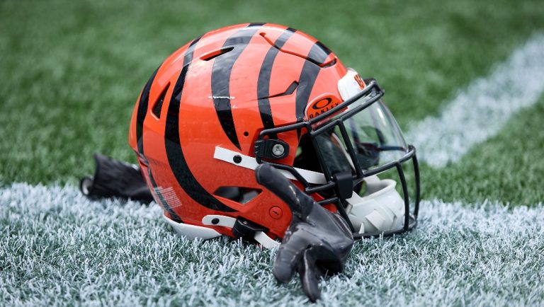A Cincinnati Bengals helmet sits on the turf prior to an NFL Football game against the Carolina Panthers, Sunday, Sep. 29, 2024, in Charlotte, N.C. (AP Photo/Brian Westerholt)