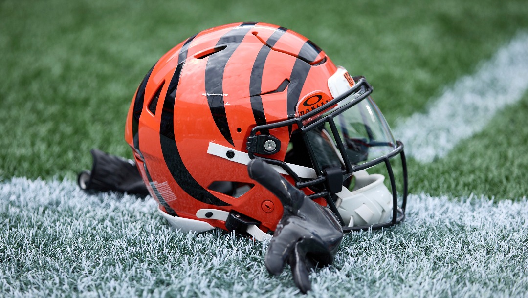 A Cincinnati Bengals helmet sits on the turf prior to an NFL Football game against the Carolina Panthers, Sunday, Sep. 29, 2024, in Charlotte, N.C. (AP Photo/Brian Westerholt)