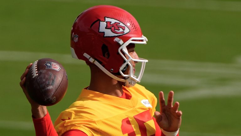 Kansas City Chiefs quarterback Patrick Mahomes passes the ball at NFL football training camp Tuesday, July 22, 2025, in St. Joseph, Mo. (AP Photo/Charlie Riedel)
