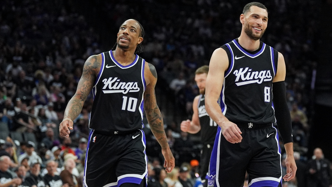 Zach Lavine #8 and DeMar DeRozan #10 of the Sacramento Kings smile between plays against the Phoenix Suns in the second quarter at Golden 1 Center on April 13, 2025 in Sacramento, California.