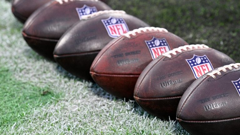 Footballs are viewed on the field before an NFL football game between the Jacksonville Jaguars and the Tennessee Titans, Sunday, Dec. 29, 2024, in Jacksonville, Fla. (AP Photo/Phelan M. Ebenhack)