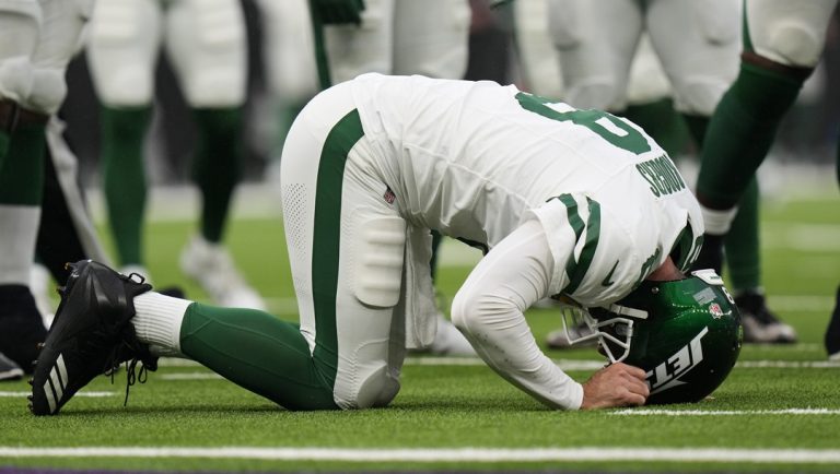 New York Jets quarterback Aaron Rodgers (8) lays on the field after an injury during an NFL football game against the Minnesota Vikings at Tottenham Hotspur Stadium, Sunday, Oct. 6, 2024 in London.