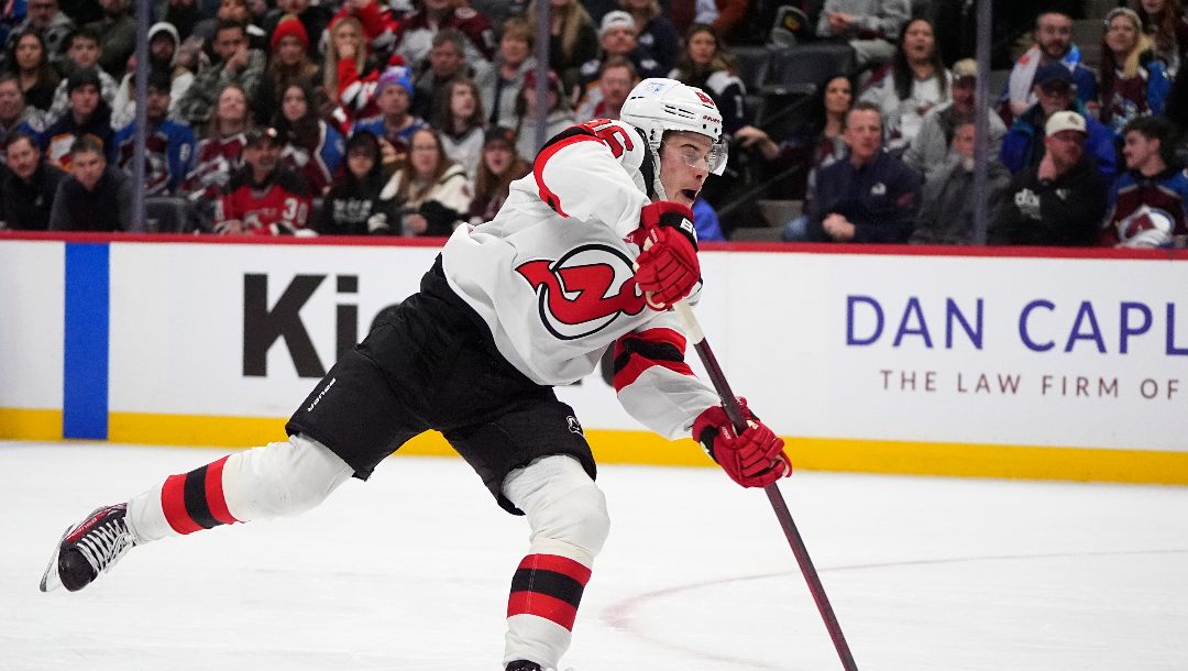 New Jersey Devils center Jack Hughes shoots the puck in the second period of an NHL hockey game against the Colorado Avalanche Wednesday, Feb. 26, 2025, in Denver.