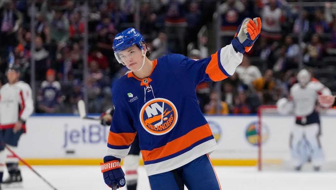 New York Islanders' Matthew Schaefer (48) celebrates after a goal he scored was reviewed during the third period of an NHL hockey game against the Washington Capitals Saturday, Oct. 11, 2025, in Elmont, N.Y.