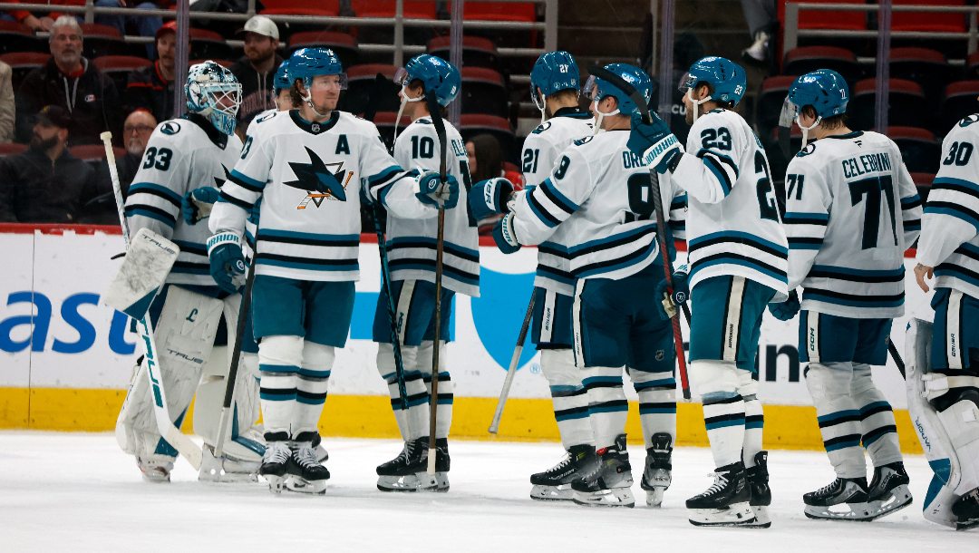 San Jose Sharks celebrate after their win over the Carolina Hurricanes in an NHL hockey game in Raleigh, N.C., Sunday, Dec. 7, 2025.